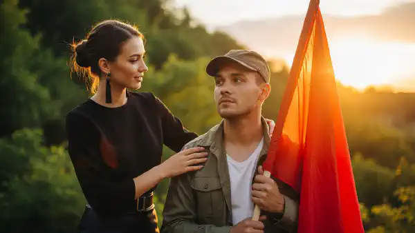A stylish young woman, helping a pensive contemporary revolutionary.